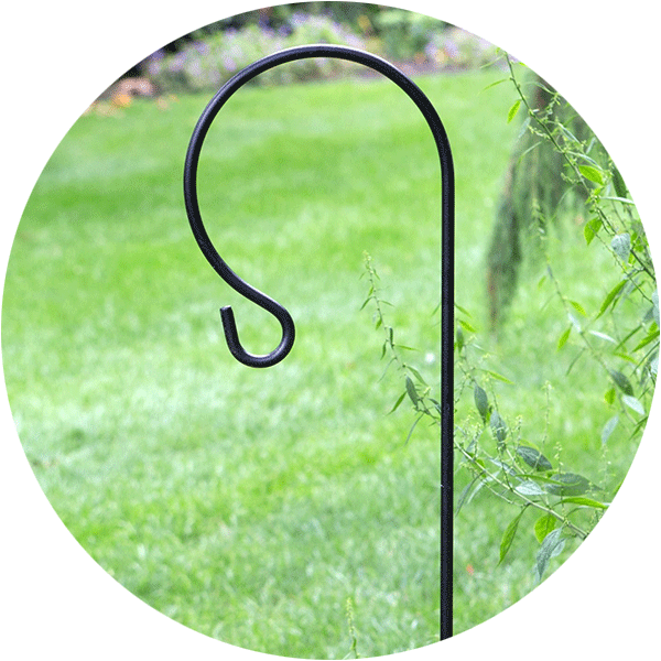 Single shephards hook in a green garden area